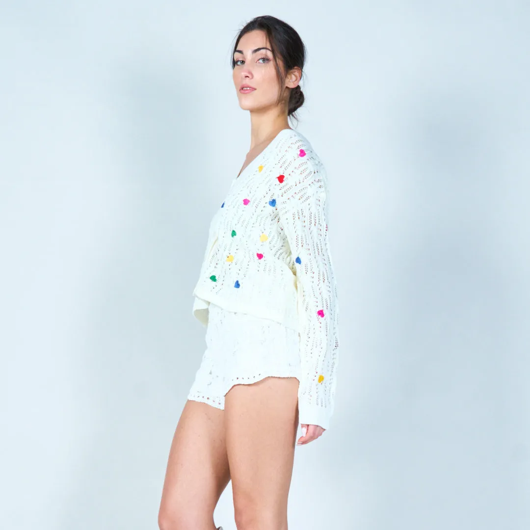 Open-knit cardigan with heart accents wholesale